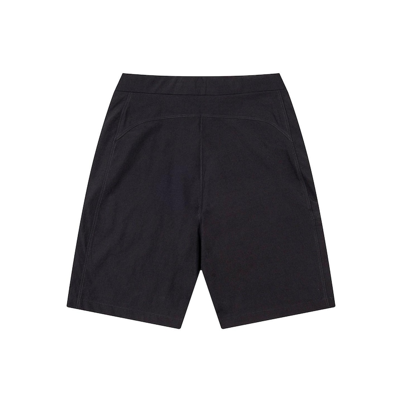 May include: Black shorts with a high waist and a tailored fit. The shorts have a simple design with a smooth texture and visible stitching details. The garment is made of a dark fabric.