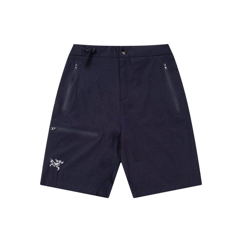 May include: Navy blue shorts with multiple zippered pockets and a drawstring waist. The shorts feature a small, white logo on the left leg. These shorts are designed for outdoor activities and are made of a lightweight, durable material.