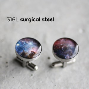 May include: A pair of silver cufflinks with a galaxy image on the front. The cufflinks are made of 316L surgical steel.