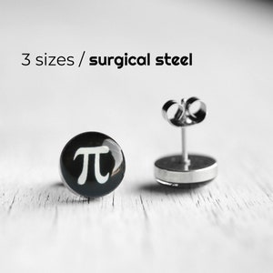 May include: A pair of black and white surgical steel earrings with a white pi symbol on a black background. 3 sizes available.