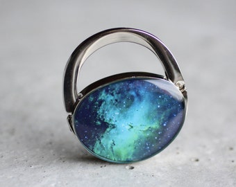 Percha de bolso espacial, joyería de bolso del universo aguamarina, soporte de bolsa de polvo de estrellas verde, gancho de bolso de nebulosa azul, gancho de bolso plegable turquesa