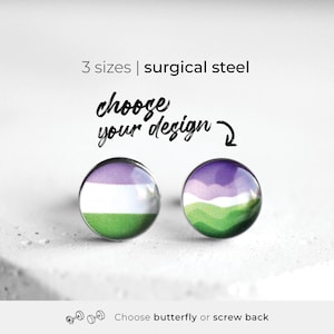 May include: Two round stud earrings made of surgical steel. The left earring features a horizontal purple, white, and green flag pattern. The right earring displays a purple, white, and green mountain landscape. Text reads: 3 sizes | surgical steel, choose your design, Choose butterfly or screw back.