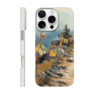 May include: A phone case with a landscape painting of a mountain path and prayer flags. The case has a white side profile and a glossy finish. The artwork shows a rocky trail, trees, and a distant mountain range.