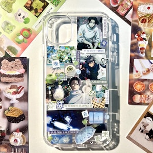 May include: A clear phone case decorated with a collage of anime-style illustrations, including characters with dark hair, a white wolf, a blue umbrella, and various Japanese text characters. The design features multiple rectangular and square images.