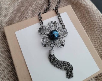 Vintage filigree flower necklace with metallic blue pearl