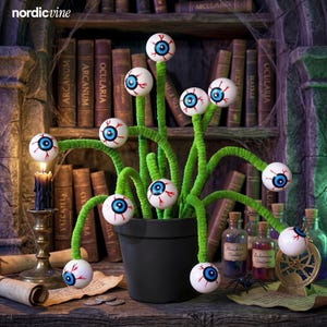 May include: A black pot containing multiple green fuzzy stems, each topped with a white sphere featuring a blue iris and red veins. The stems extend outward in various directions, creating a cluster of eyeball-like decorations.