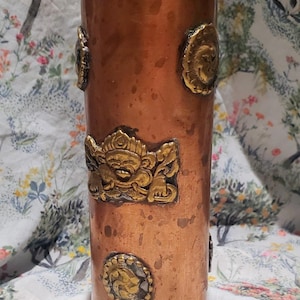 May include: A set of three ceramic mugs with a speckled, matte finish. The mugs are in shades of cream, light gray, and dark gray. Each mug has a simple, minimalist design and a rounded handle.