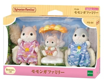 May include: Sylvanian Families FS-64 Flying Squirrel family set in packaging. Includes two adult figures in cloud-patterned outfits and one baby figure in a yellow and orange parachute accessory. The box features the text Sylvanian Families and FS-64.