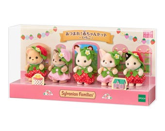 May include: A Sylvanian Families boxed set containing five flocked animal figures dressed in strawberry-themed outfits. Each figure wears a red or pink polka-dot dress with green leaf accents and a matching strawberry hat. The box features Japanese text.