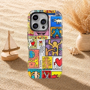 May include: A rectangular smartphone case featuring a vibrant collage of Keith Haring's iconic pop art illustrations. The design includes colourful figures, a cat with a red heart, a globe, and various abstract shapes in bold black outlines.