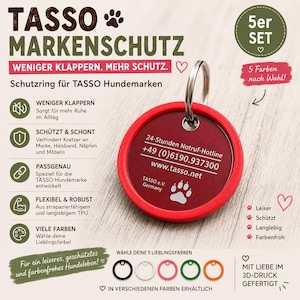 Könnte beinhalten: Ein roter, kreisförmiger Schutzring für eine Tasso-Hundemarke mit Metallring. Die Marke zeigt den Text 24-Stunden Notruf-Hotline, +49 (0)6190.937300, www.tasso.net, Tasso e.V. Germany und ein Pfoten-Symbol. Erhältlich in fünf verschiedenen Farben.
