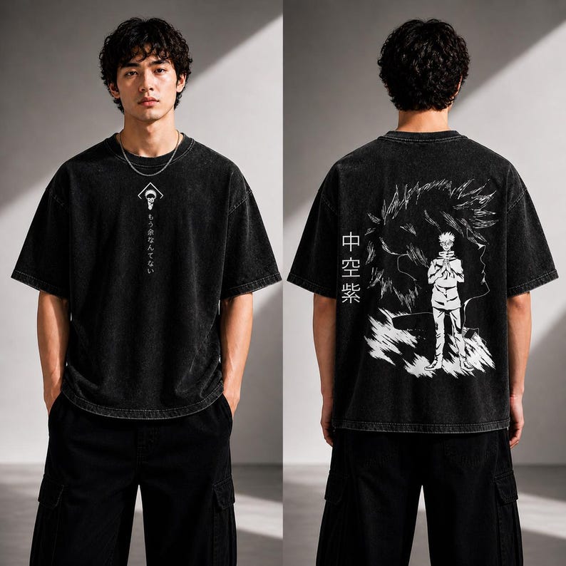 May include: Black t-shirt with a graphic design on the front and back. The front features a white symbol and Japanese text. The back displays a white illustration of a character and Japanese text. The shirt has short sleeves and a relaxed fit.