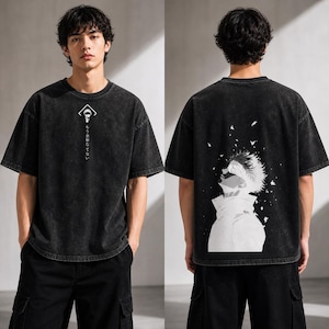May include: Black, oversized t-shirt with a faded wash effect. The front features a white graphic and Japanese text. The back displays a large black and white anime-style illustration of a character looking upwards.