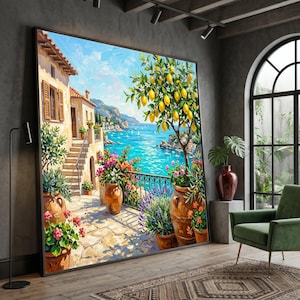 May include: A large framed wall art print depicting a coastal Mediterranean scene with a stone villa, a lemon tree in a terracotta pot, vibrant flowers, and a blue sea view. The painting features warm sunlight, stone steps, and a balcony railing.