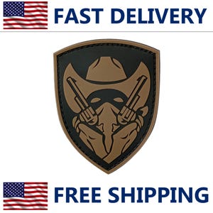 May include: A shield-shaped patch featuring a cowboy hat, two revolvers, and a masked face in brown and black. The patch has a black border and the text "FAST DELIVERY" and "FREE SHIPPING" in blue.