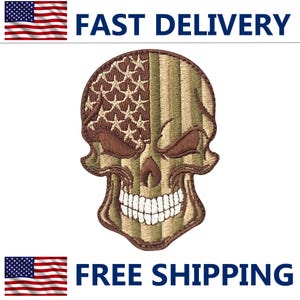 May include: Embroidered skull patch with an American flag design. The left side features a brown star pattern, while the right side has vertical stripes in shades of green and brown. The patch has a detailed, stitched appearance.