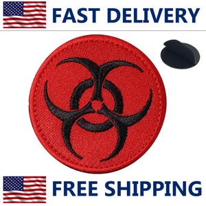 May include: A round, red patch with a black biohazard symbol in the center. The patch has a stitched border and a black adhesive backing. The words "FAST DELIVERY" and "FREE SHIPPING" are displayed.
