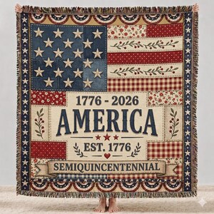 May include: A patriotic throw blanket featuring an American flag design with stars and stripes. The blanket includes the text "1776-2026 AMERICA EST. 1776 SEMIQUINCENTENNIAL" in a vintage style. The blanket has a fringed edge.