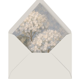 May include: A light gray envelope with a triangular flap, featuring an interior liner printed with an impressionistic painting of white hydrangea flowers against a soft, muted blue and gray background, showcasing textured brushstrokes.