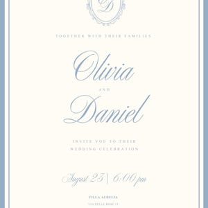 May include: A rectangular wedding invitation card with a light blue border on a cream background. It features the monogram OD in an oval frame, the names Olivia and Daniel, and the text: Together with their families, invite you to their wedding celebration, August 23 | 6:00 pm, Villa Aurelia, Via delle Rose 15, Florence, Italy.