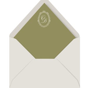 May include: An open white envelope with a sage green interior. The interior features a white, ornate monogram design. The envelope is a classic design, suitable for invitations or announcements.
