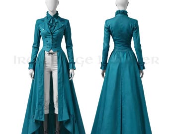 May include: A teal long-sleeved coat with a high ruffled collar, front buttons, and a split front hem revealing white trousers. The coat features a long, flowing back panel with ruffled cuffs. The ensemble is displayed on two mannequins.