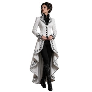 May include: A white, long-line coat with black floral embroidery and a high collar. The coat features a button-down front and a dramatic, flowing skirt. The sleeves and hem are detailed with black embroidery, creating a striking contrast.