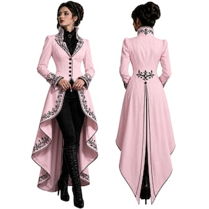 May include: A light pink, long coat with black embroidered floral designs. The coat features a high collar, button-down front, and a dramatic, flowing tail. The sleeves and edges are trimmed with black embroidery. The coat is paired with black pants and boots.