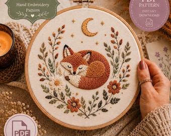 May include: Embroidered hoop art depicting a sleeping fox with a crescent moon and floral details. The design includes the text "Fox Hand Embroidery Pattern" and "PDF Pattern Instant Download". The color scheme features orange, brown, and cream hues.