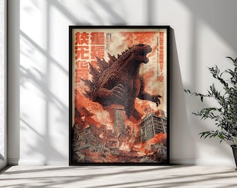May include: A framed poster featuring a large, dark, reptilian monster roaring over a burning city. The scene is dominated by fiery orange and red tones, with Japanese text characters vertically aligned on the left and right sides of the artwork.