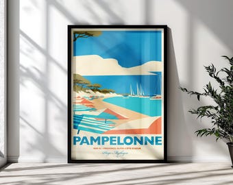 May include: A framed travel poster featuring a stylized beach scene of Pampelonne with blue water, sandy shores, striped umbrellas, and sailboats. The text reads PAMPELONNE, VAR 83, PROVENCE-ALPES-CÔTE D'AZUR, and Plage Mythique in blue and black.
