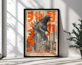May include: A framed vertical poster featuring a large, textured gray monster standing over a detailed cityscape. The artwork includes bold, bright orange Japanese characters layered over the scene, with a distressed, weathered paper background texture.