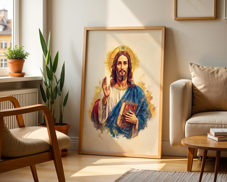 May include: A framed vertical wall art print featuring a watercolor-style illustration of a figure with long brown hair and a beard, wearing a white tunic and blue robe, holding a book, with a golden halo and a raised hand gesture.