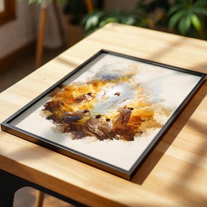 Puede incluir: Una impresi&oacute;n rectangular enmarcada que presenta una ilustraci&oacute;n estilo acuarela de una figura central con t&uacute;nicas blancas rodeada de una luz brillante, con varias figuras m&aacute;s peque&ntilde;as con t&uacute;nicas reunidas bajo nubes doradas y marrones.