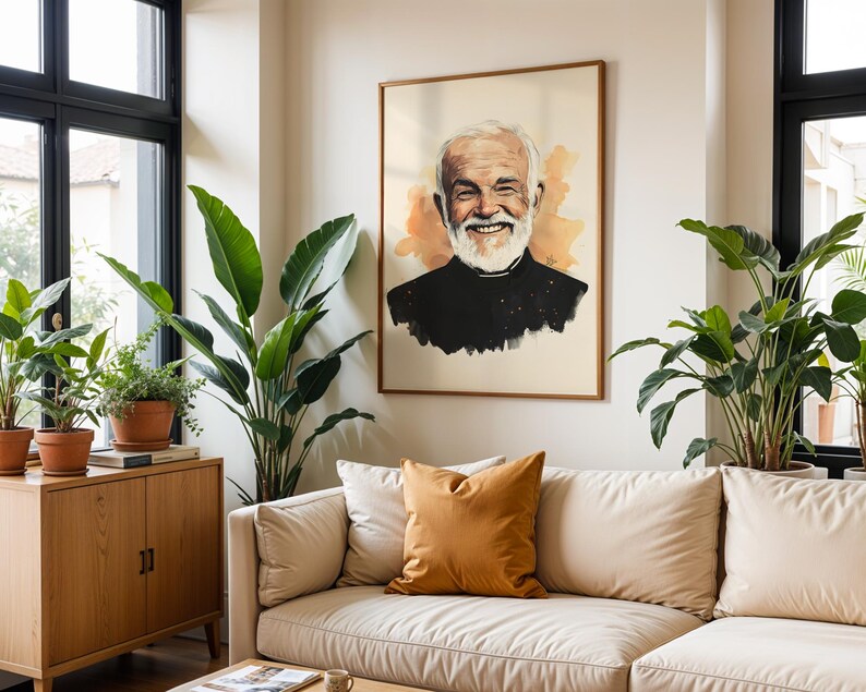 May include: A framed portrait print featuring a watercolour-style illustration of a smiling older person with a white beard, wearing a black clerical shirt with a white collar, set against a soft cream background with orange watercolour accents.