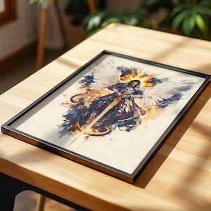 May include: A framed art print featuring a watercolour-style illustration of a winged warrior in armour holding a glowing sword. The figure has large white wings and is surrounded by dark blue and orange abstract splashes of colour on a light background.