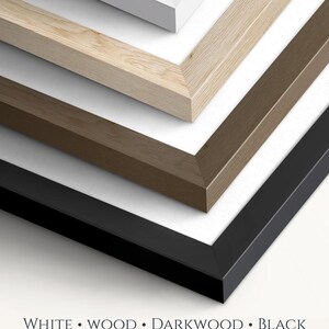 May include: A stack of four rectangular picture frames in white, light wood, dark wood, and black finishes, each featuring a mitered corner design. The text below reads: WHITE &bull; WOOD &bull; DARKWOOD &bull; BLACK. Choose your frame.