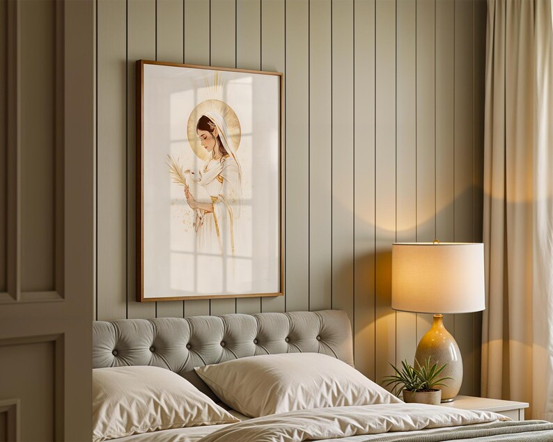 May include: A framed wall art print featuring a watercolour-style illustration of a figure with a golden halo, wearing a white head covering and robe, holding a white dove and a palm frond, rendered in soft neutral tones with gold accents.