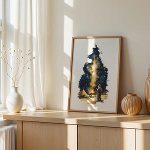 May include: A framed vertical art print featuring a dark blue and gold celestial scene with a figure standing in a desert landscape near a tent, illuminated by a bright, glowing vertical light formation resembling a nebula or starry sky.