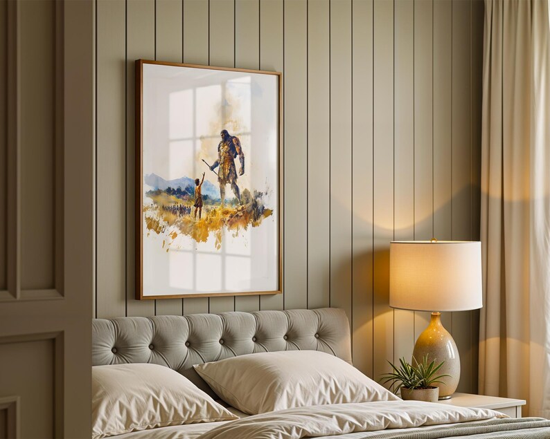 May include: A framed wall art print featuring a watercolor illustration of a small figure reaching toward a towering, dark-colored giant standing in a golden field. The artwork is displayed in a thin wooden frame on a vertical paneled wall.