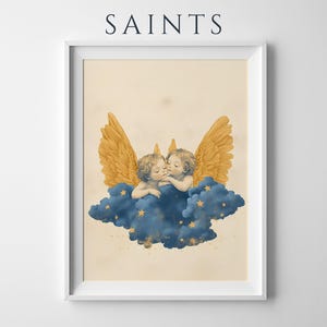 May include: A framed art print featuring the word SAINTS in dark blue text at the top. The illustration depicts two cherubs with golden wings resting on a dark blue cloud filled with small yellow stars, set against a light beige background.