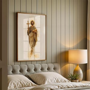 Peut inclure: Une impression d'art mural encadr&eacute;e repr&eacute;sentant une illustration &agrave; l'aquarelle d'un personnage barbu v&ecirc;tu de robes, tenant une croix en bois dans une main et un pain dans l'autre, avec une aur&eacute;ole dor&eacute;e derri&egrave;re la t&ecirc;te sur fond blanc.