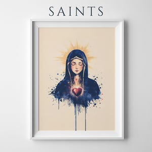 May include: A framed art print titled SAINTS featuring a watercolor-style illustration of a figure in a dark blue hooded cloak with eyes closed. A glowing red heart is centered on the chest with golden light rays radiating from behind the head.