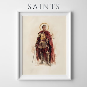 Puede incluir: Una l&aacute;mina art&iacute;stica enmarcada titulada SAINTS que presenta una ilustraci&oacute;n en acuarela de una figura con armadura met&aacute;lica y una capa roja fluida. La figura tiene un halo dorado, sostiene una espada y se encuentra sobre un fondo claro.