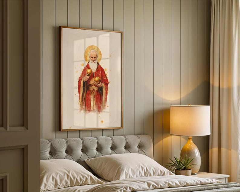 May include: A framed wall art print featuring a bearded figure in a red robe with a gold halo, holding two golden spheres. The artwork is rendered in a watercolour style with gold splatter accents, presented in a simple wooden frame.