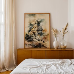May include: A framed watercolor print depicting a multi-tiered ancient tower structure with dark, moody clouds and a group of small figures walking toward the base, rendered in shades of brown, blue, and cream on a textured paper background.