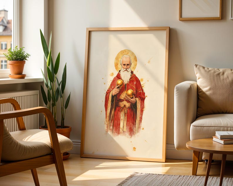 May include: A framed wall art print featuring a watercolor-style illustration of a bearded figure with a golden halo, wearing a red robe and holding two golden spheres. The artwork is displayed in a light wood frame against a neutral wall.