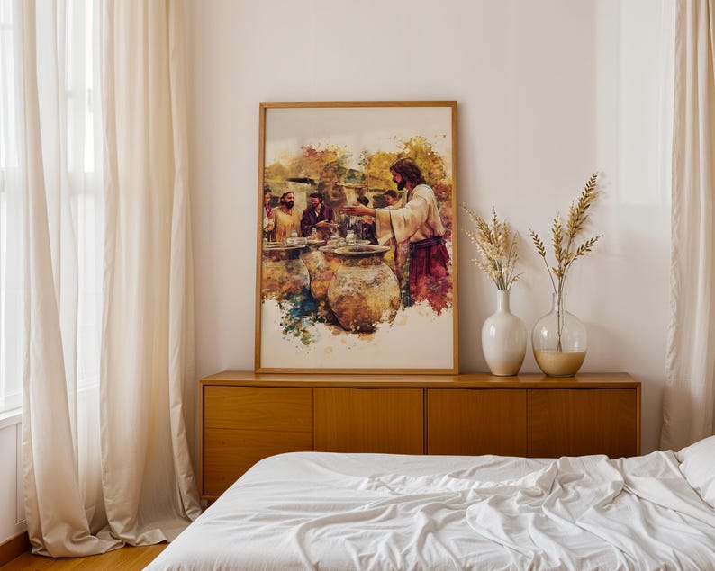 May include: A framed watercolor-style print depicting a biblical scene with a central figure in robes gesturing toward large clay vessels, surrounded by other individuals. The artwork features warm earth tones, golden yellows, and deep reds.