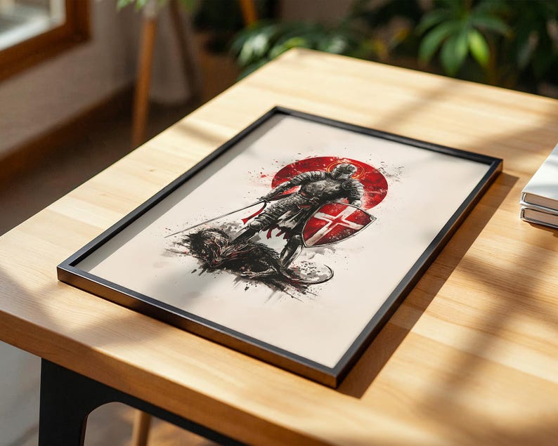 May include: A framed art print featuring a dark, ink-style illustration of a knight in armour standing over a defeated creature. The knight holds a sword and a shield with a red cross, set against a bold red circular background on a cream paper.