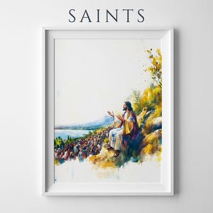 May include: A framed watercolor-style print titled SAINTS, depicting a figure with long hair and robes sitting on a rocky hillside, gesturing toward a large crowd gathered below near a body of water, with yellow and green foliage accents.
